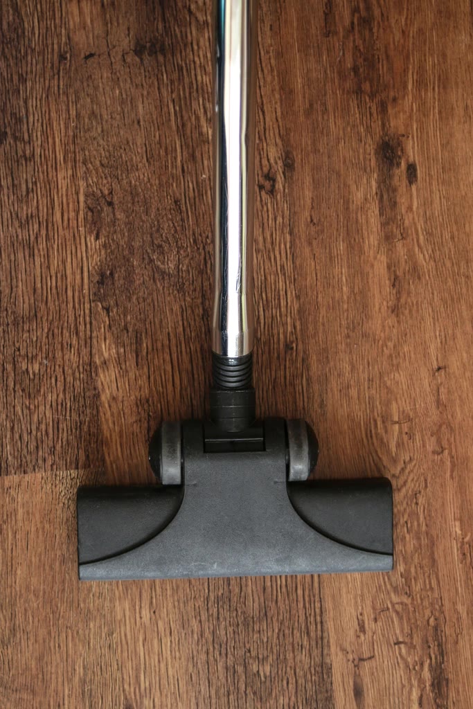 Vacuuming a timber floor